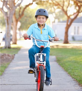 Boy riding bike harvest at limoneira