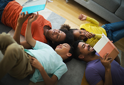 Family reading on the floor in a circle